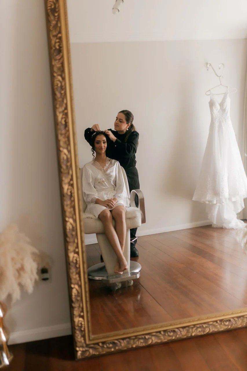Bride reflecting in salon mirror